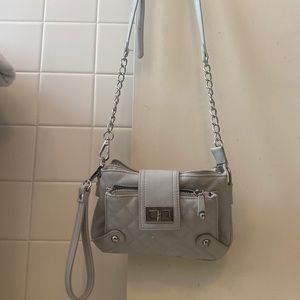 This Charming Charlie’s purse/clutch has three pockets.